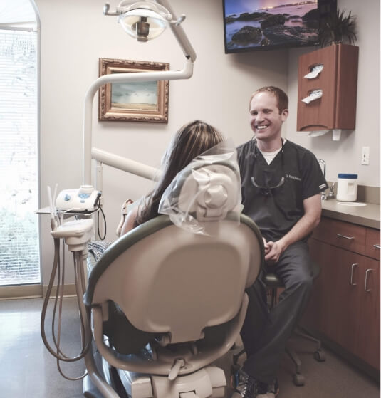 Jacksonville dentist smiling with a patient in the dental chair