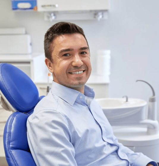 a patient smiling after undergoing clear aligner treatment