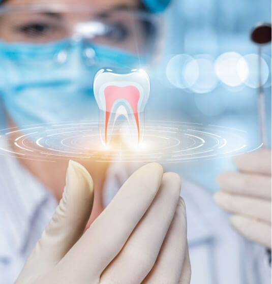 Dentist holding a hologram of a tooth in their hand