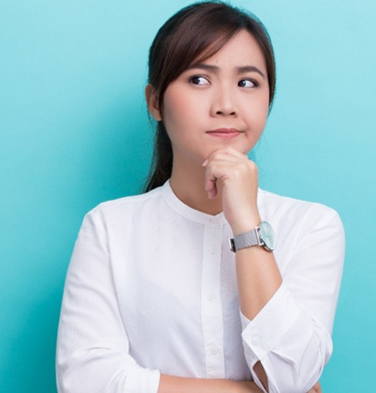 Woman thinking on a blue background