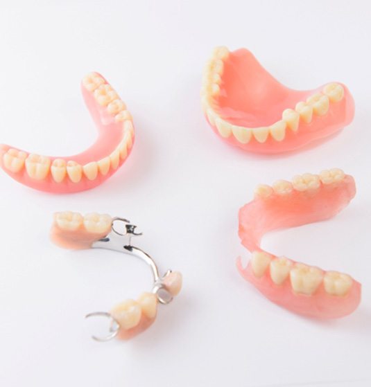 Series of dentures lying on a table