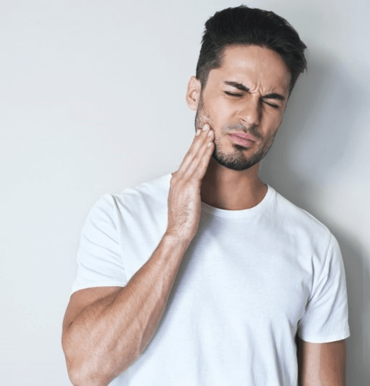 a man experiencing a dental emergency in Jacksonville