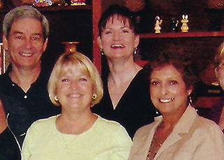 Doctor Robert Wagner and Heather Alton with former Jacksonville dental team members Betty and Janis