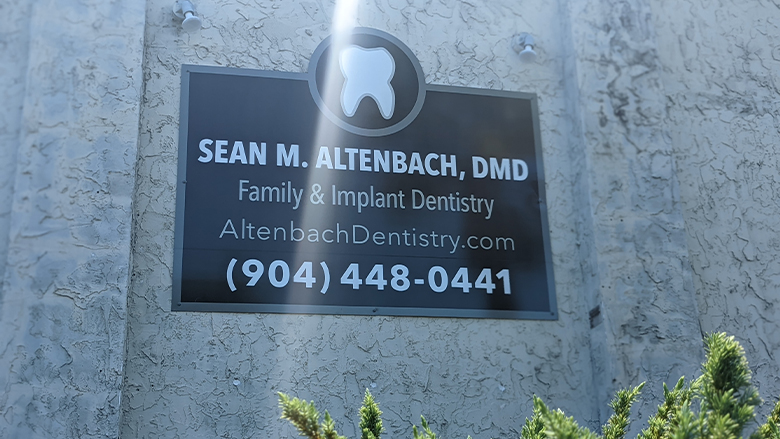 Sign reading Sean M Altenbach D M D Family and Implant Dentistry