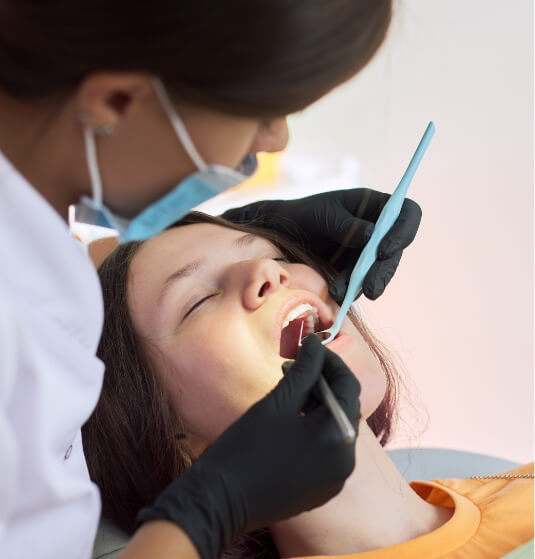 Woman receiving dental treatment from sedation dentist in Jacksonville