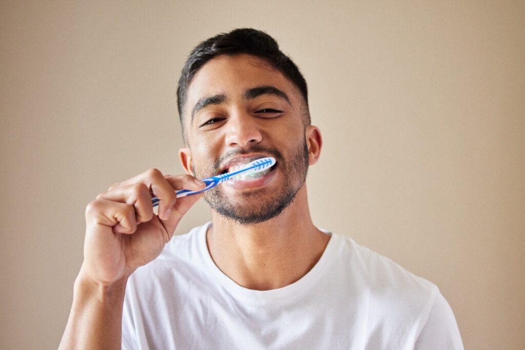 person brushing teeth