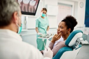 Woman with a cavity between her teeth at her dentist